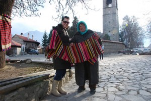 The author buying fabric from a woman in Bansko, Bulgaria
