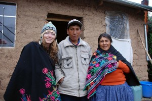 The author with Amantani Islanders Olga and Joaquin and shawls embroidered by Joaquin