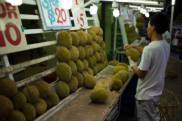 Durian Stall If the spiny exterior weren't warning enough, the durian has a less than appealing odor. This stall in Singapore has many to choose from.
