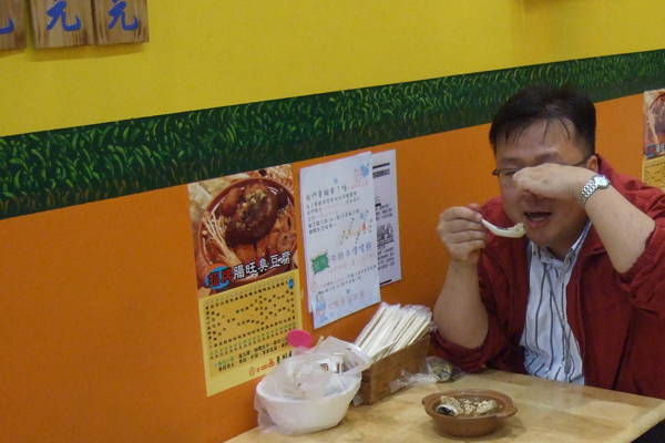 20110512-StinkyTofu Stinky tofu being eaten in Taipei.