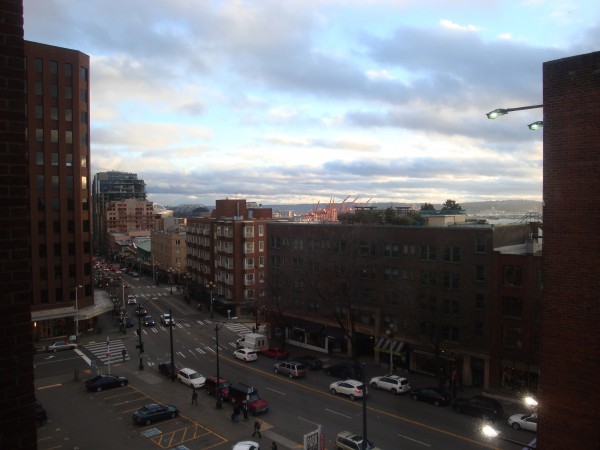 Michelle Schusterman, Associate Editor for Matador Goods, works from home in Seattle, Washington. Living downtown, her window looks out over 1st Avenue, with Puget Sound and Pike Place Market in the distance.