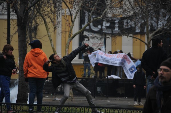 student throwing rock santiago