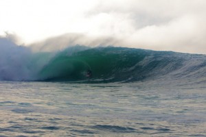 This is me during our first session of the week.  It is easy to get washed into the cliffs at this spot, the base maybe 100 feet away. This is one of the most spectacular arenas in the world to ride waves.