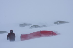 My brother pausing for a breath while digging out a tent. You can see several in the background that are nearly buried. A few hours after this shot was taken we were awoken out of our Aquavit/NyQuil haze to lots of yelling in Norwegian as two of the tents had collapsed under the weight of the drifting snow...