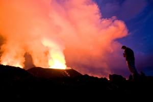 We were up at the crack of dawn the next morning to see what can only be produced by a combination of a sunrise and a volcano. Here, a Uganda-based Dutch tourist I was with understandably grabs some pictures of the scenery.