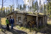 Meta gives Katie the tour of the oldest cabin on the property.  It is over 100 years old and was built by Harold's grandfather.  It was then traded to Meta's grandmother for 20 salmon. 

In our Yukon travels, we often found ourselves wondering about the stories that have played out in the historical buildings and machinery junkyards.    We really appreciated our time at Kwaday Dan Kenji  because it's possible to get the backstory firsthand.