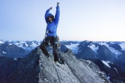 Katie celebrates on the summit just before dark after 13 hours of climbing