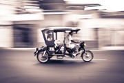 While my husband was brokering a deal on a boat down the Amazon River, I stood in the heat and sticky humidity of Iquitos, "panning" the fury of tuk tuks flying past me. The streets were teeming with them. Families with their groceries stacked high headed home, tourist taxis and local workers ending the day all buzzing up and down the streets. Some passengers waved or threw up peace signs as they went past, and I followed them with my camera. Iquitos was a city of motion, very much alive, like the Amazon rainforest we were about to enter. 

[18mm, ISO 100, f 7.1, 1/15]

This postcard comes to us from Maryanne Wirkkanen, who currently lives in Vancouver, BC, Canada. A love of travel, adventure, and photography takes her around the world with her husband. You can find some of her photography on her tumblr: M.Word