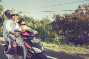 Family of 3 riding a motorbike