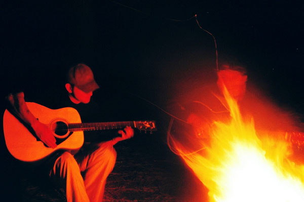 campfire guitarist