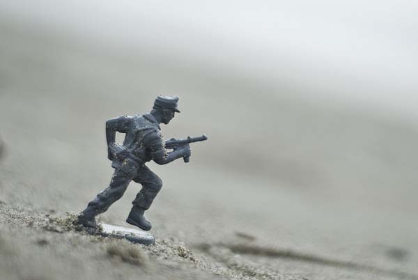 Toy infantryman upon beach