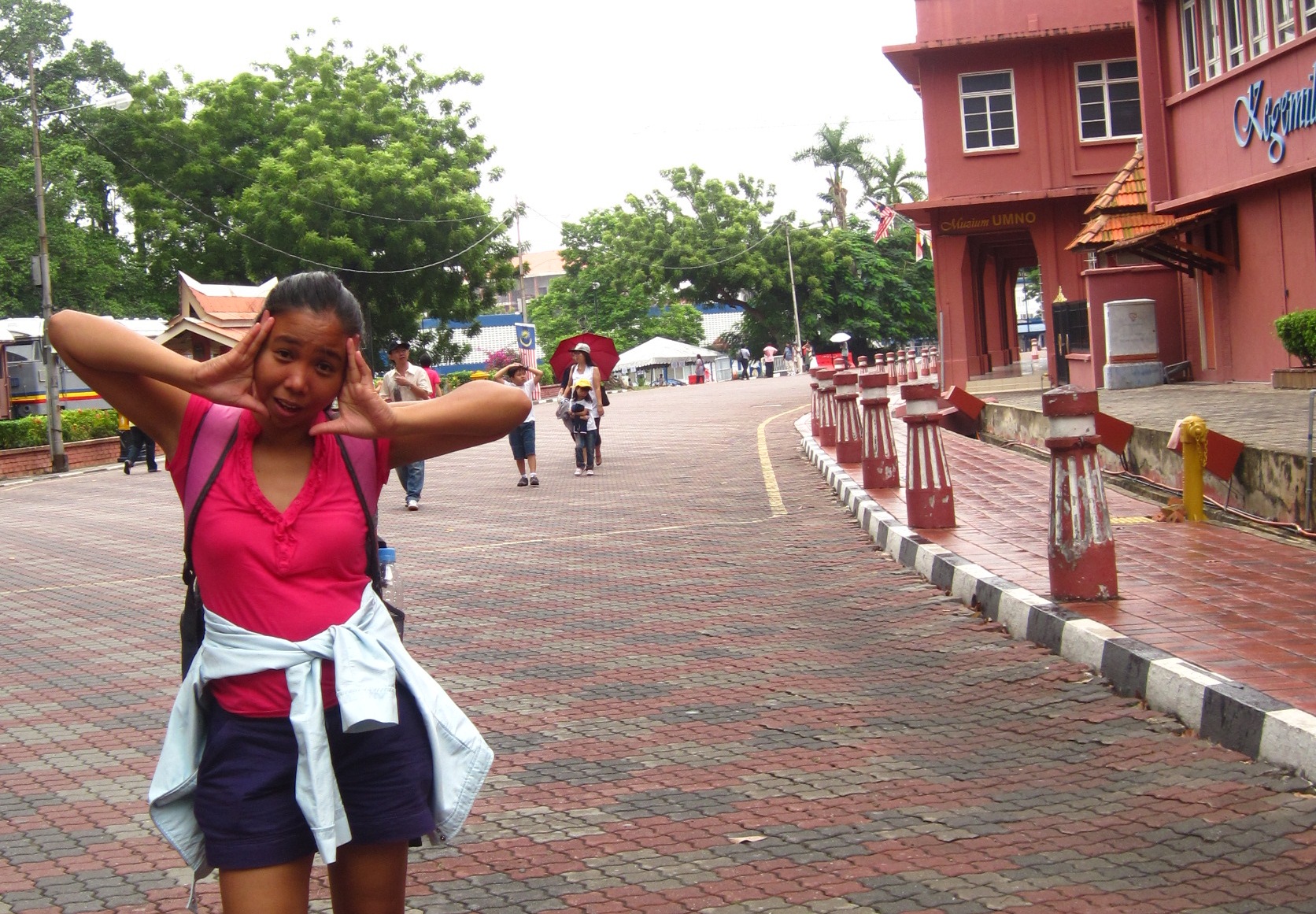 The author at an old Portuguese square in Malacca, Malaysia, September 2010. Perhaps, hungry? Perhaps, confused? One thing is certain - she's glad to have gone beyond her backyard for the language lesson at for a lot more.