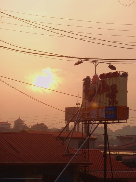 the sun setting over the restaurant on the mountain.jpg