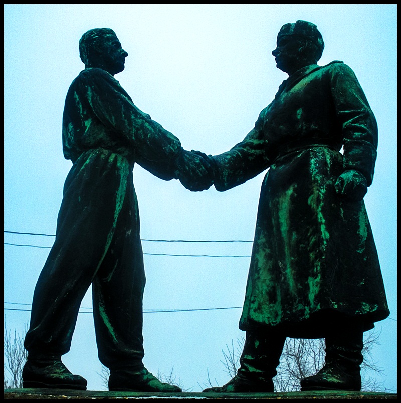 Comrades. The Soviet soldier meets the Hungarian man symbolising their friendship.