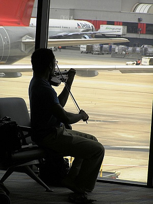 Playing Violin at Airport