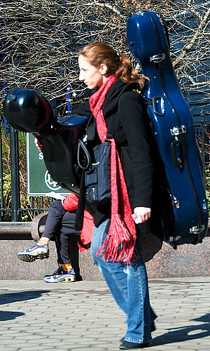 Woman carrying guitars