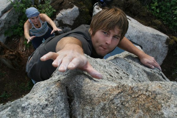 Bouldering: reaching for a hold