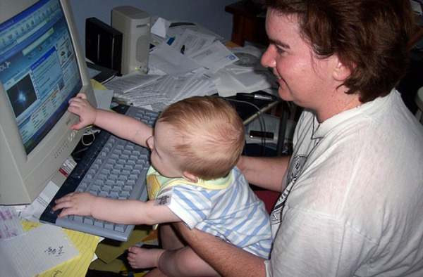 Baby playing on computer