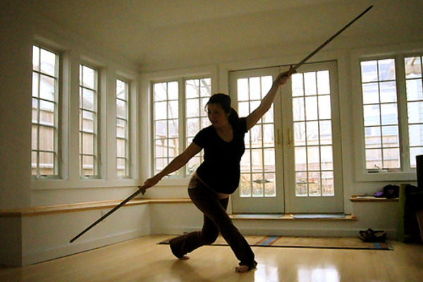 Pregnant woman sword-fighting
