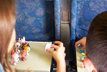 children playing with toys on airplane