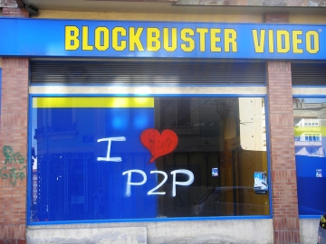 blockbuster film rental emporium with we love p2p tagged upon a window