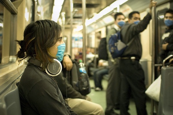 Woman on subway wearing mask