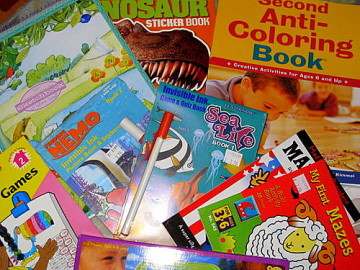 a pile of coloring books for children