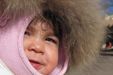 inuit baby in a fur hood