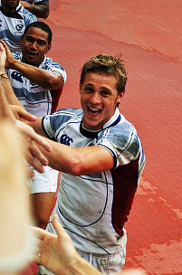 Rugby players greet fans