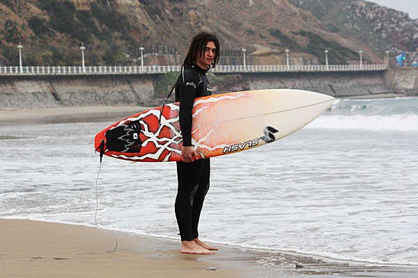 Surfer slicing a big wave in Spain
