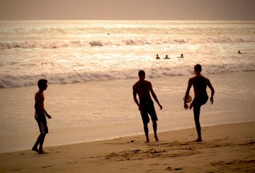 Playing soccer on the beach