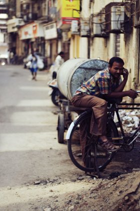 Man with bicycle in Mumbai, India