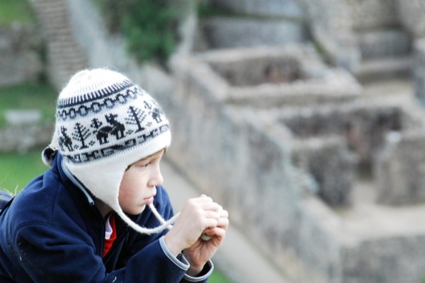 Child ponders Machu Picchu