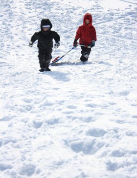 Family snow sledding