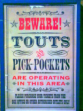 pickpockets and touts sign
