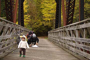 Daughter walking on bridge