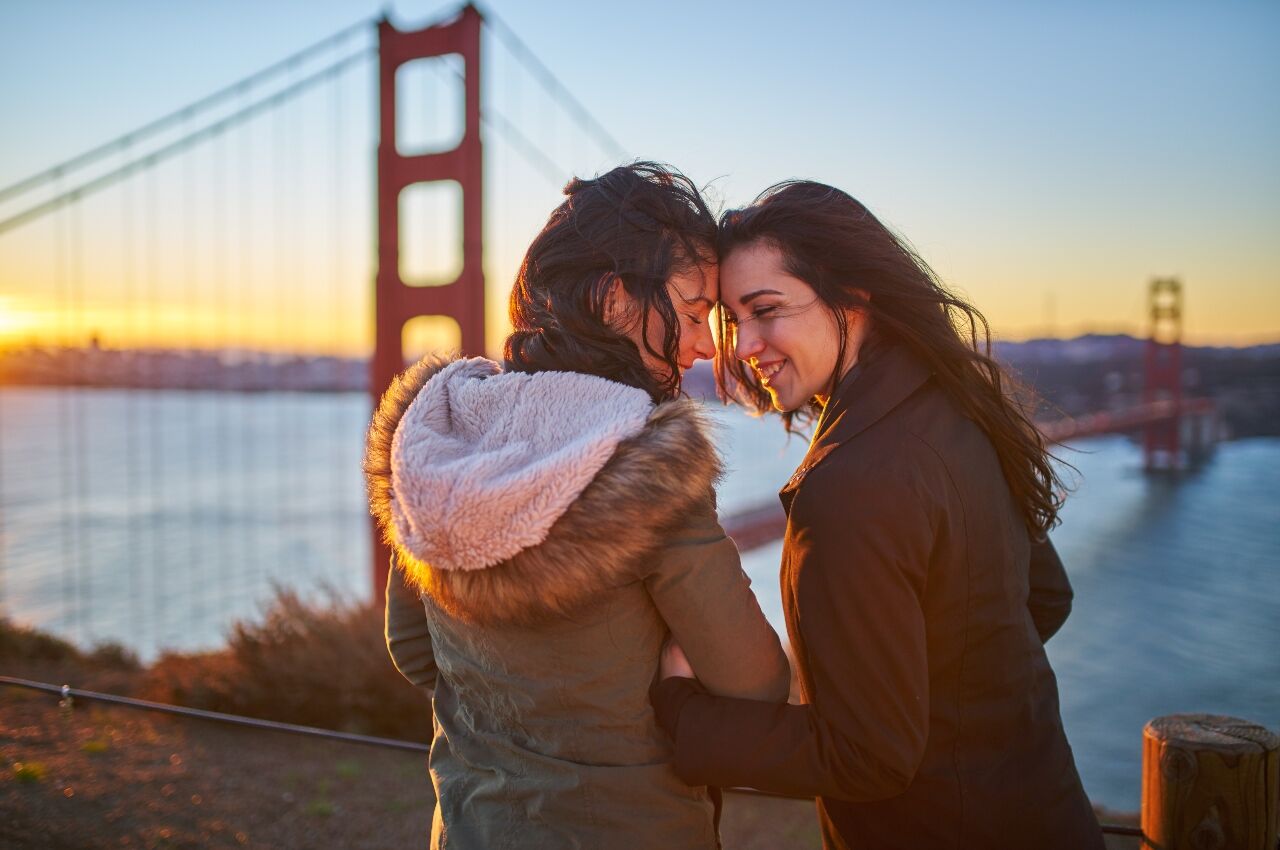 Couple at sunset with the Golden Gate Bridge in the background