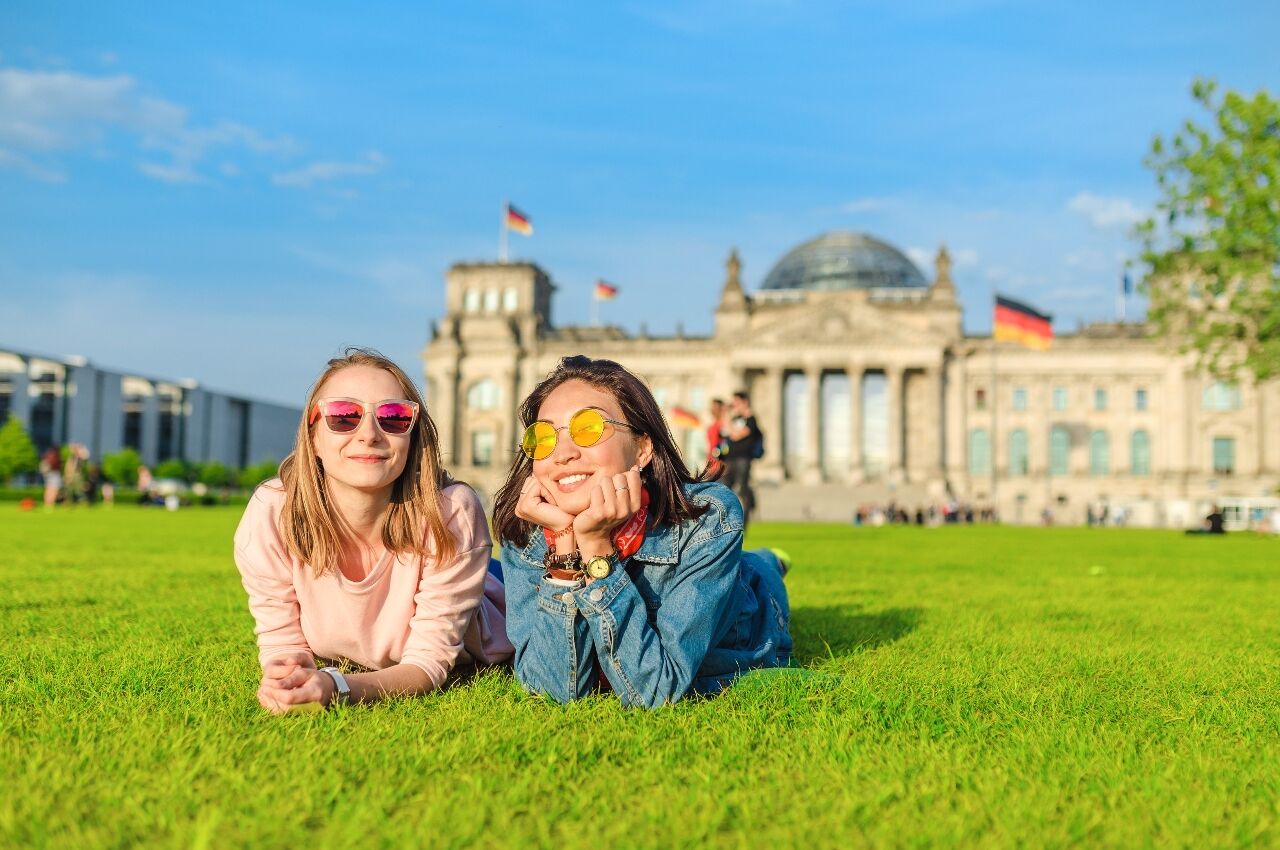 Two girls on grass in Berlin one of the best gay friendly cities in europe