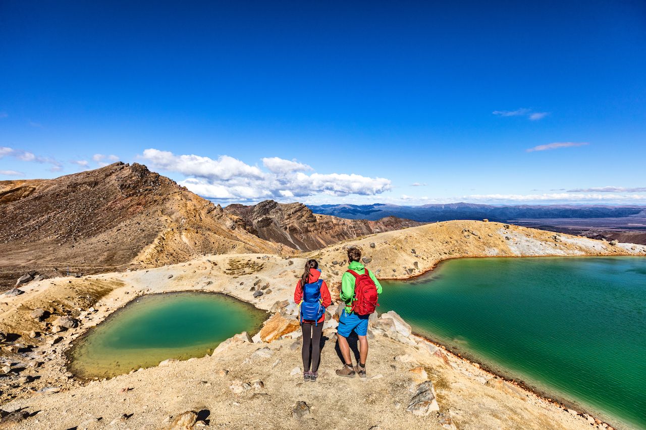 Couple hiking in New Zealand one of the happiest countries in the world
