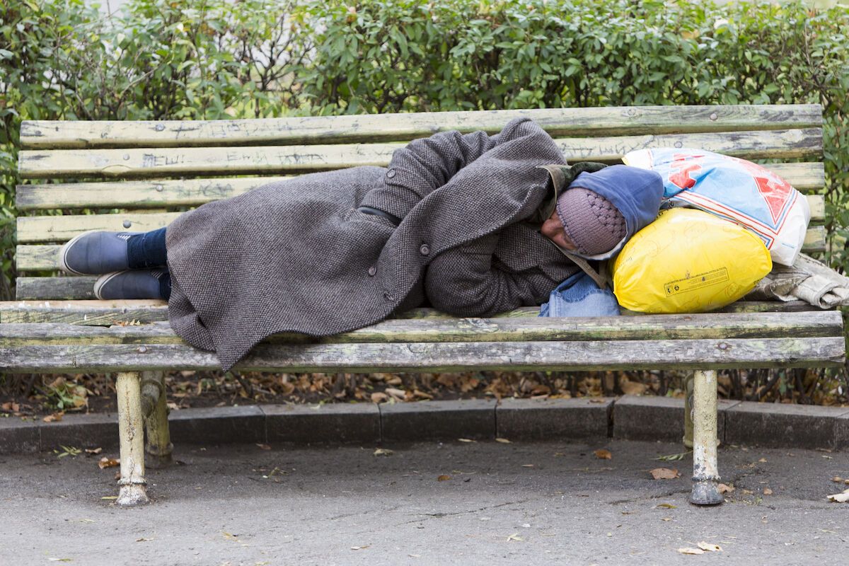 7 Assumptions We Need To Stop Making About The Homeless   Homeless Sleeping On A Bech In The Park 1200x800 