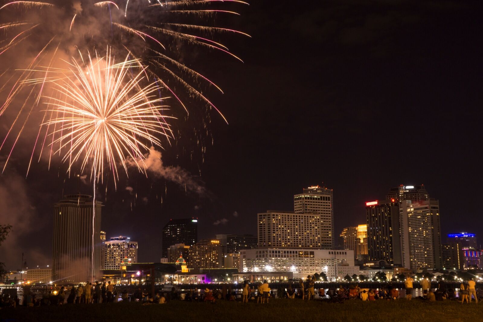 Fourth of July 2018 Fireworks show in New Orleans, LA with the city skyline in the background across the Mississippi River