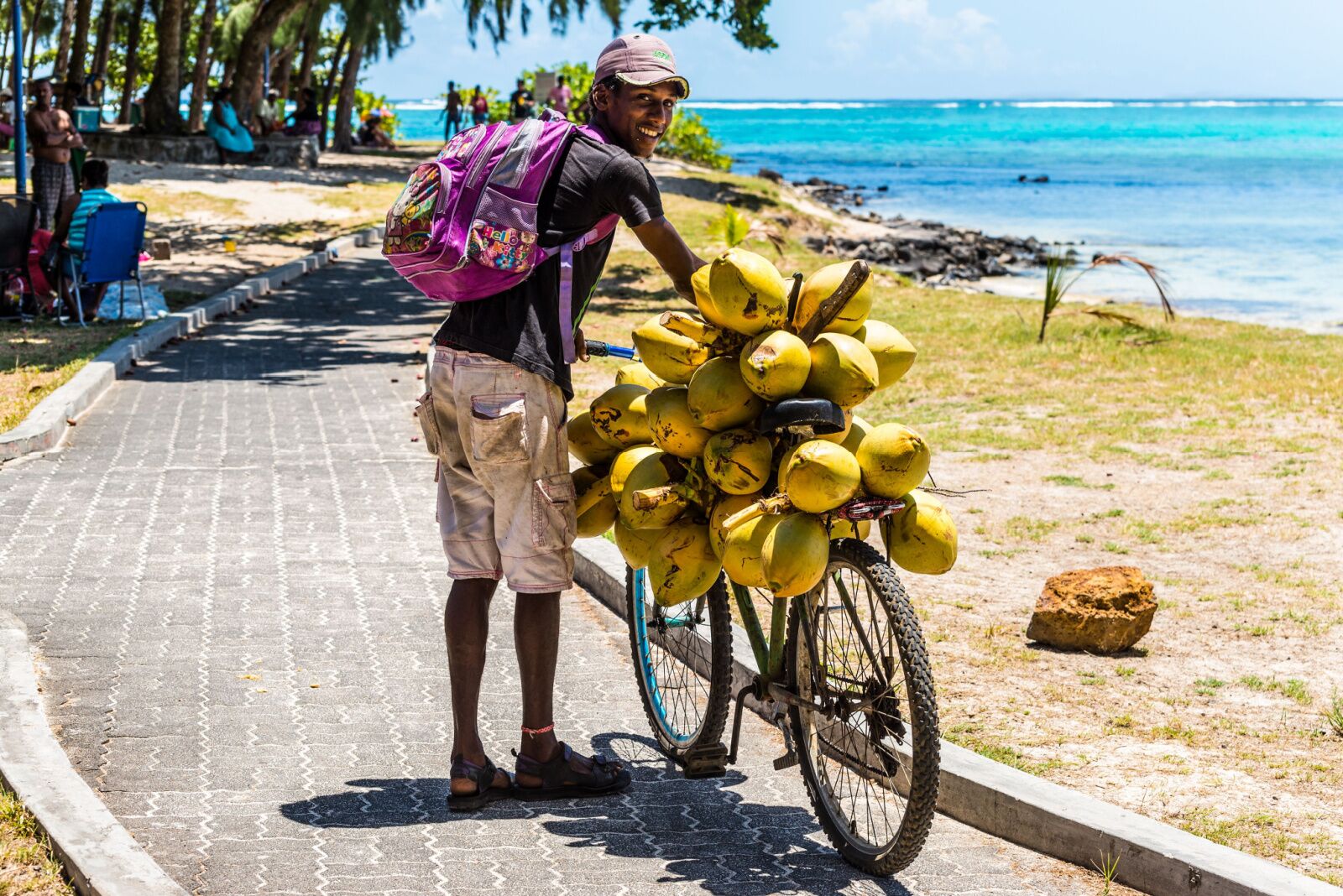 Mauritius vacation - man with coconuts 