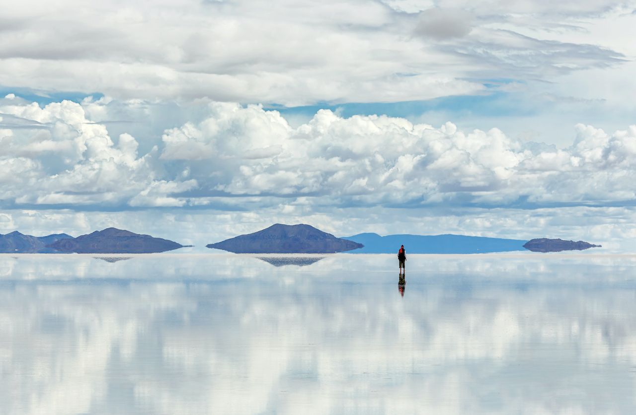 Uyuni Salt Flats man on reflection