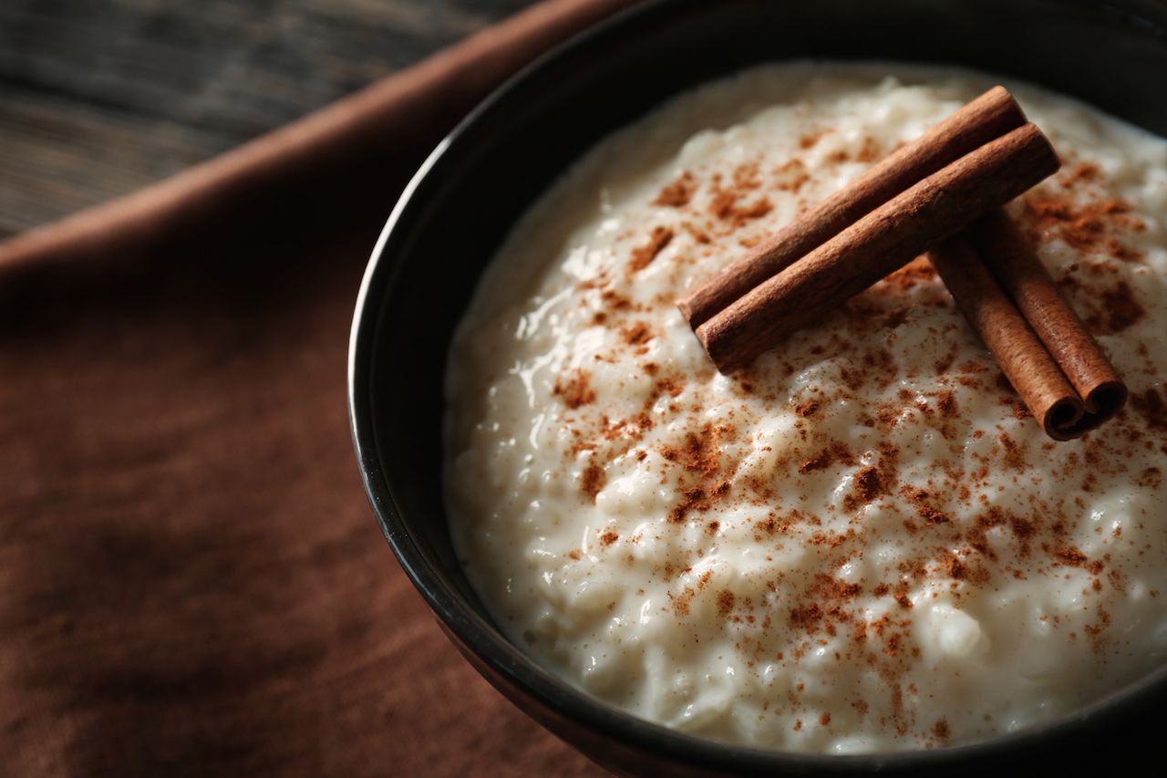 A bowl of rizogalo, a Greek dessert made with rice and milk and topped with cinnamon