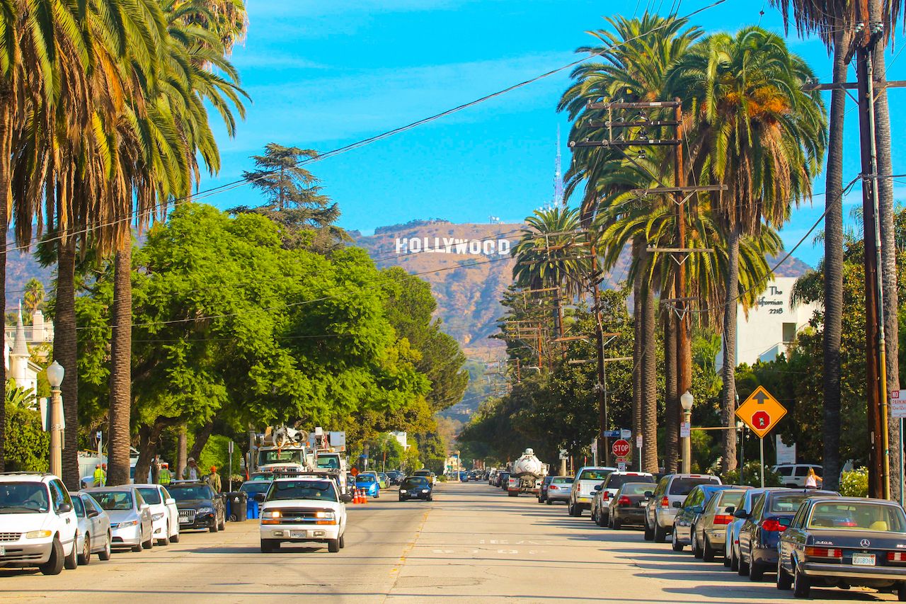 View of the Hollywood sign through palm trees in Los Angeles one of the best bachelorette party destinations in the US
