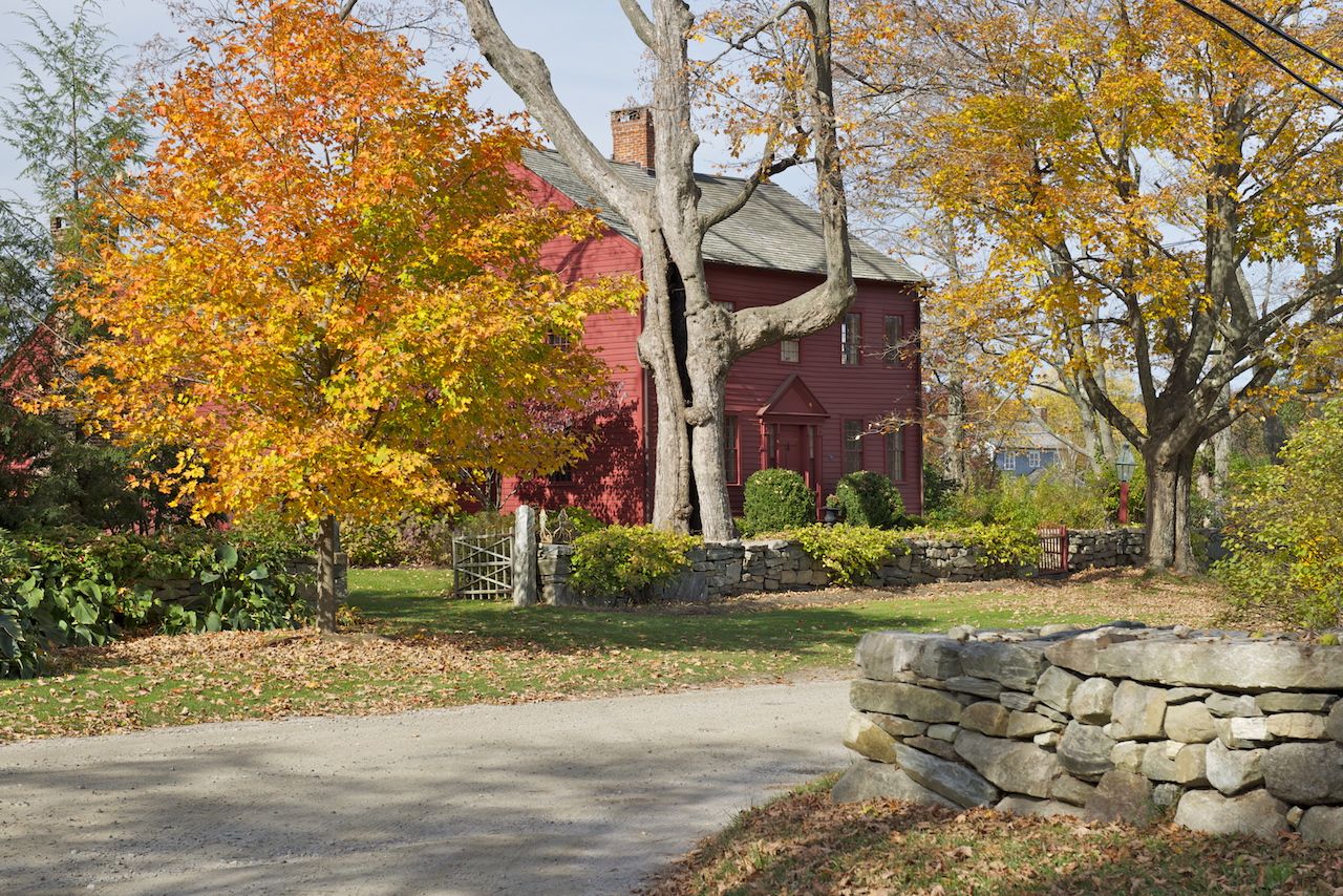 Red cottage in the Connecticut countryside on a fall foliage road trip