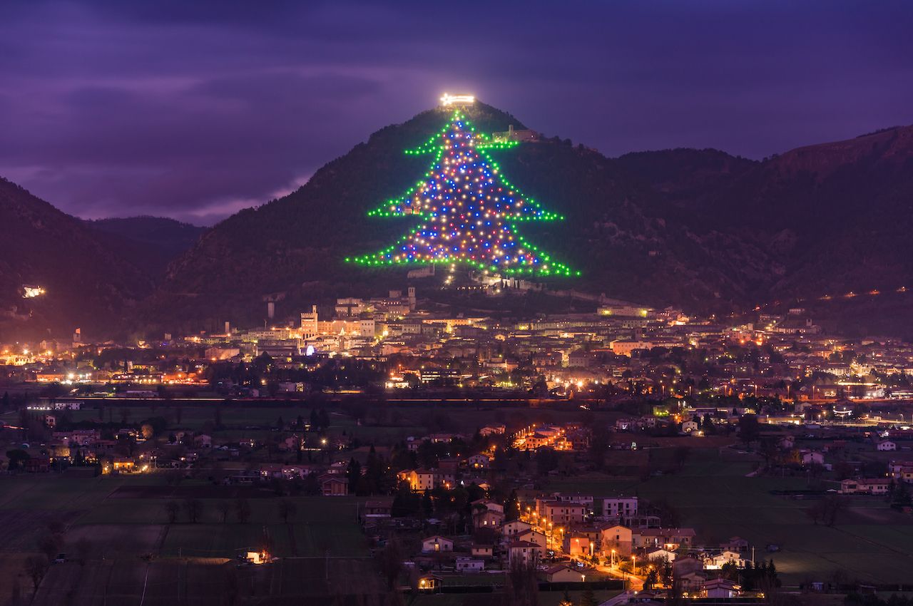 A Christmas tree light display on a hillside in Gubbio, Italy