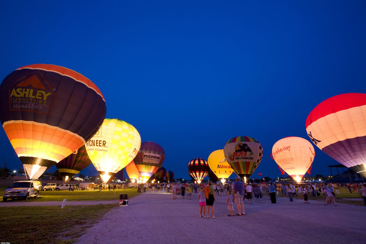 Hot air balloons light up the evening sky at Indiana State Fairgrounds