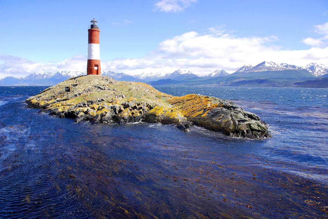 Red and white lighthouse in blue sky in Beagle Channel Ushuaia Patagonia Argentina
