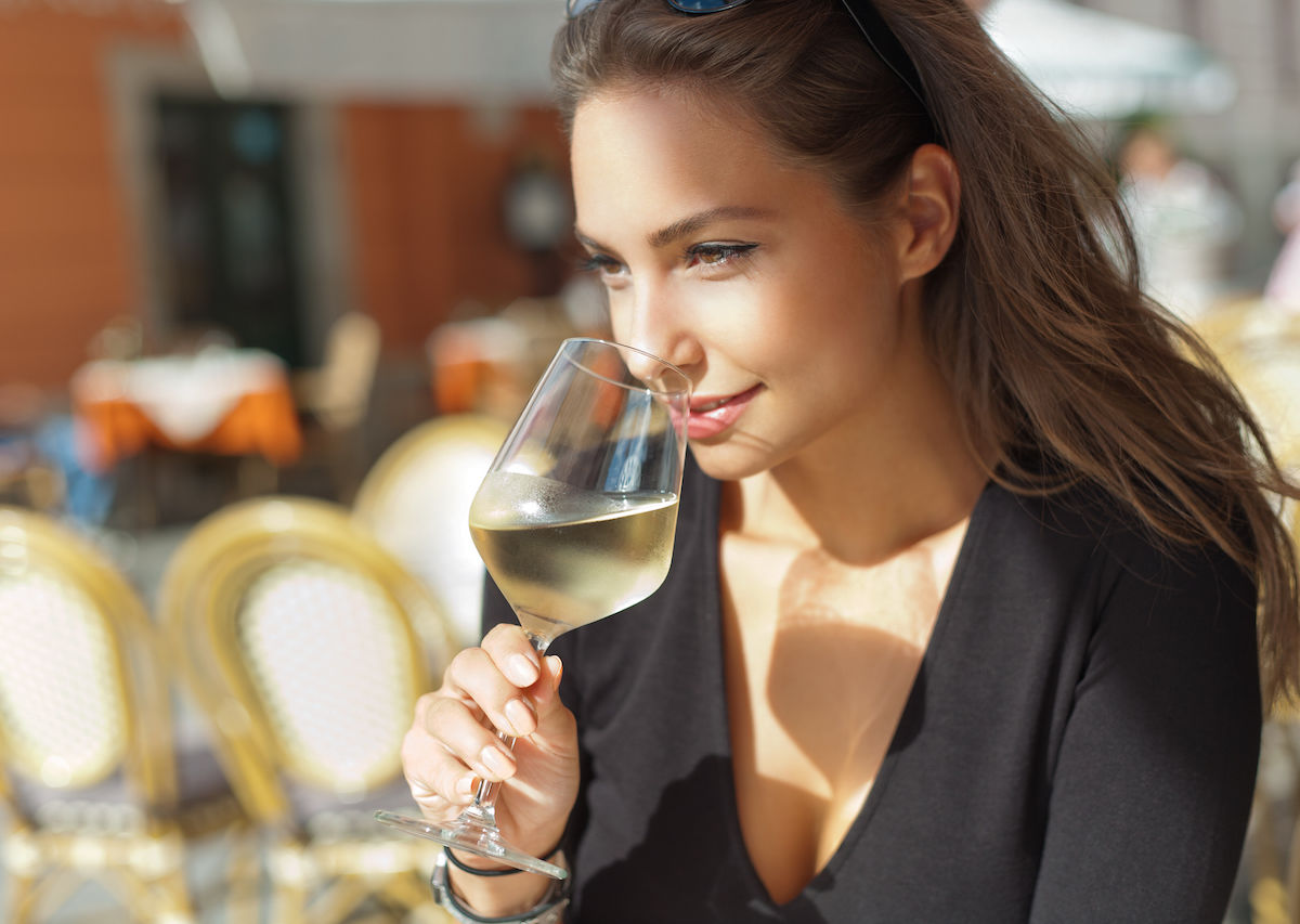 Woman-drinking-a-glass-of-white-wine-1200x853.jpg